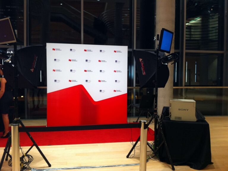 luxury experiential photo studio pop up, with branded backdrop and prints.